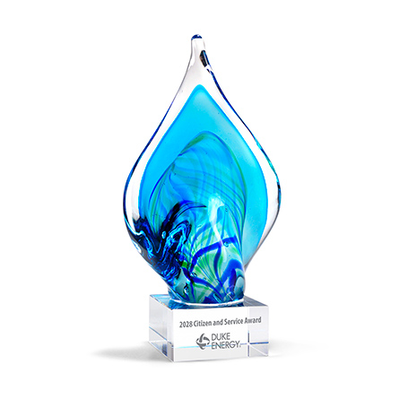 GM866,Premium,Glass,Award,with,Blue,and,Green,Twist,Art,Glass,Accent,on,Clear,Base,AwardPremium Art Glass Flame Award featuring a blue and green flame shape  mounted on a clear base. Each piece is uniquely hand-made; size, color, and air bubbles may vary. Personalize on the base with sandblasting. Plate not included.