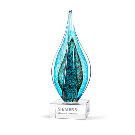 GM868,Premium,Glass,Award,with,Teal,and,Green,Teardrop,with,Gold,Metallic,Accent,on,Clear,Base,AwardPremium Art Glass Flame Award featuring teal and green colors with a gold metallic accent. Each piece is uniquely hand-crafted; color, size, and air bubbles may vary. Personalize on the base with sandblasting.